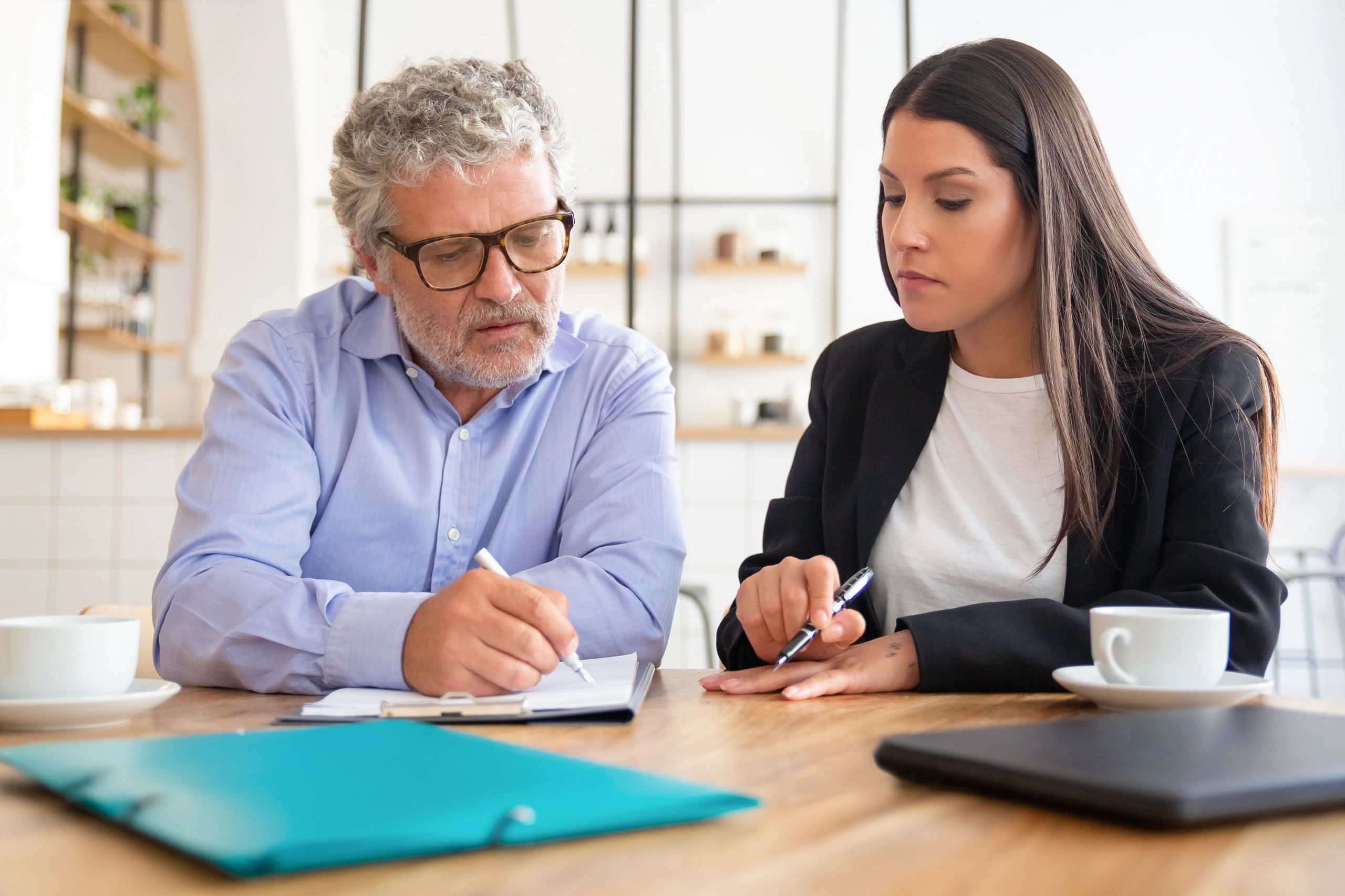 Insurance client reviewing policy options with an agent